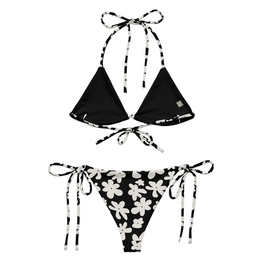 A stylish and comfortable bikini set called the Midnight Flower Bikini Set, made from high-quality, soft, and stretchy recycled material with UPF 50+ sun protection. This eco-friendly bikini set is perfect for swimming, sunbathing, or poolside lounging. I