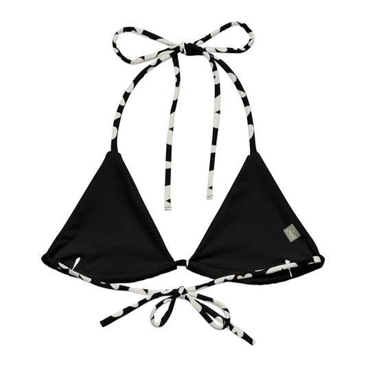 A stylish and comfortable bikini top called the Midnight Flower Bikini Top, made from recycled polyester with UPF 50+ sun protection. This flattering top features a black and white floral print and comes in a wide range of sizes, from XS to 6XL, to ensure