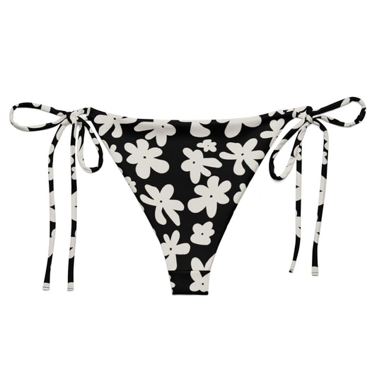 A stylish and comfortable bikini bottom called the Midnight Flower, made from recycled plastic with UPF 50+ sun protection. Part of a larger collection of swimwear also called Midnight Flower, this flattering bikini bottom is available in sizes ranging fr