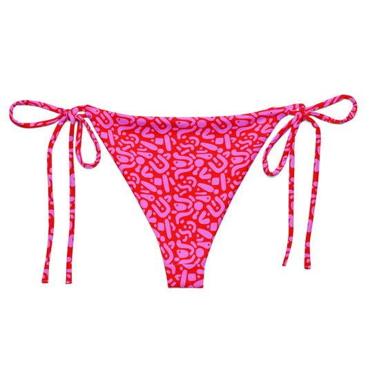 Sustainable Ruby Reef Bikini Set bottoms in red and pink geometric pattern made with recycled plastic. Available in a range of sizes from 2XS to 6XL. Long lasting bikini, multiple ways to wear and buttery soft fabric. Made to order, just for you